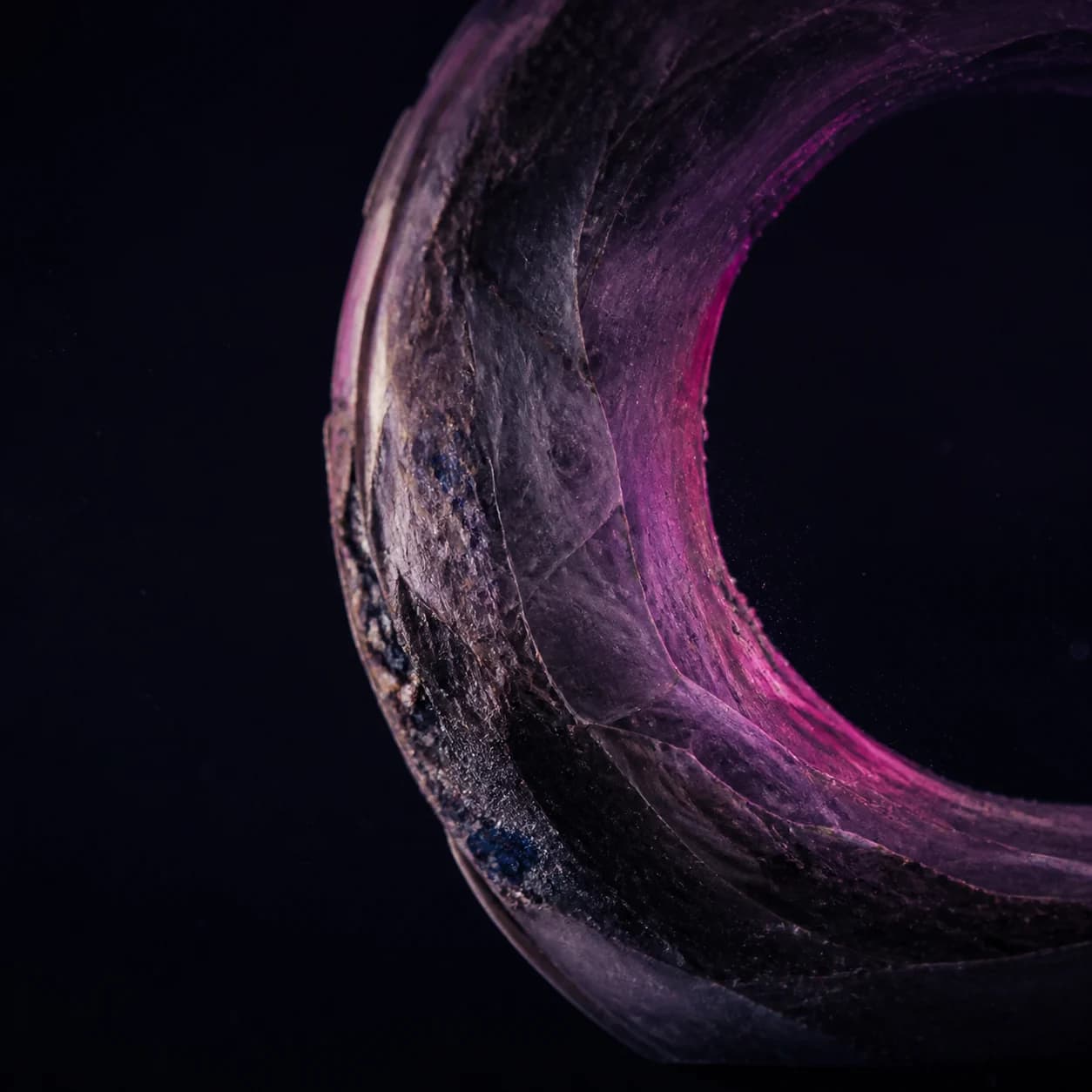 Abstract orbital forms in glass, stone, and paper